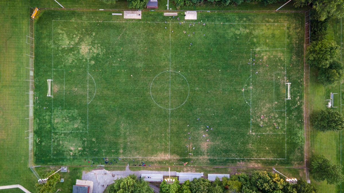 green soccer field during daytime