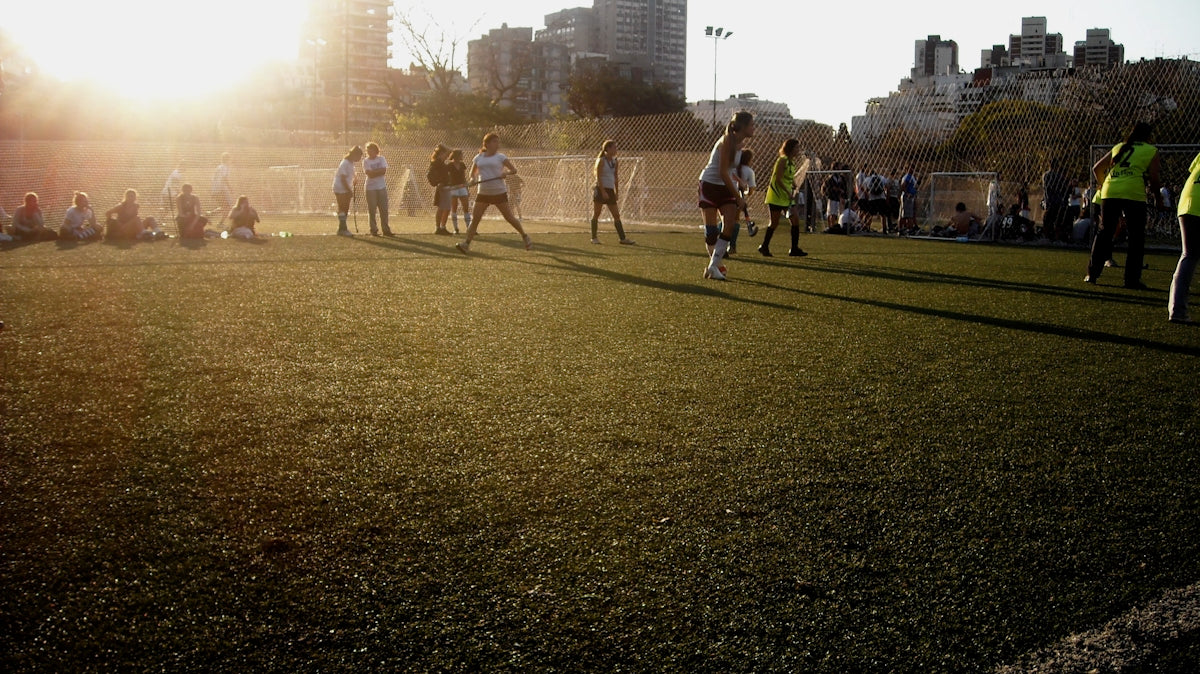 people walking on green grass field during daytime