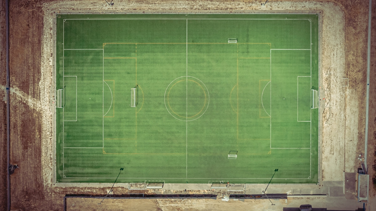 green soccer field during daytime