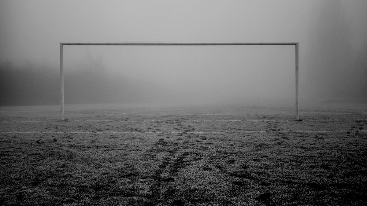 a soccer goal in the middle of a field