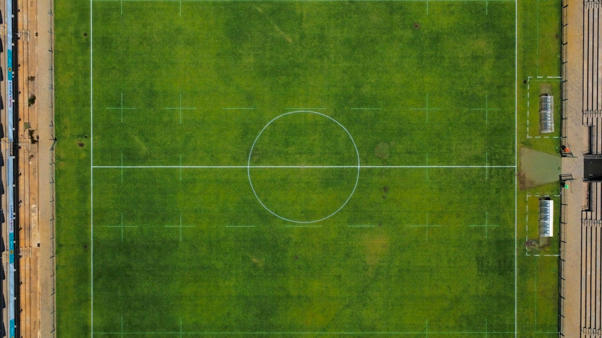 an aerial view of a soccer field in a city