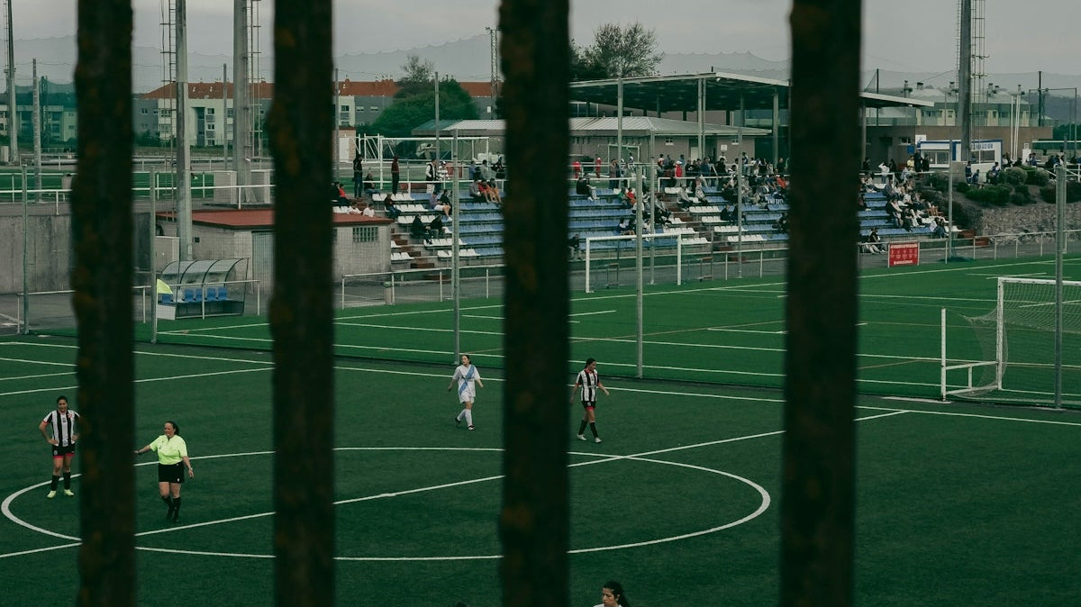 a group of people playing a game of soccer