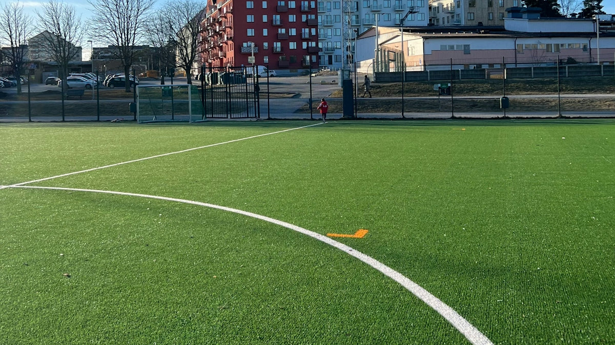 a soccer field with a white line on it
