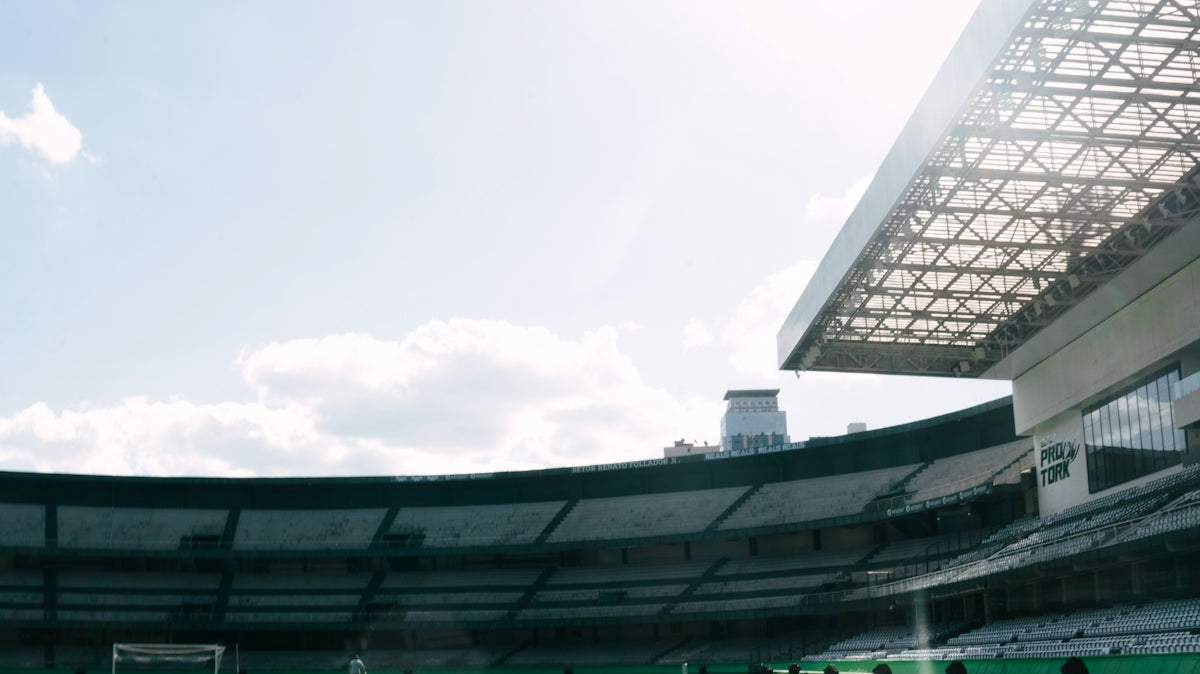 A sunny day at a large empty football stadium