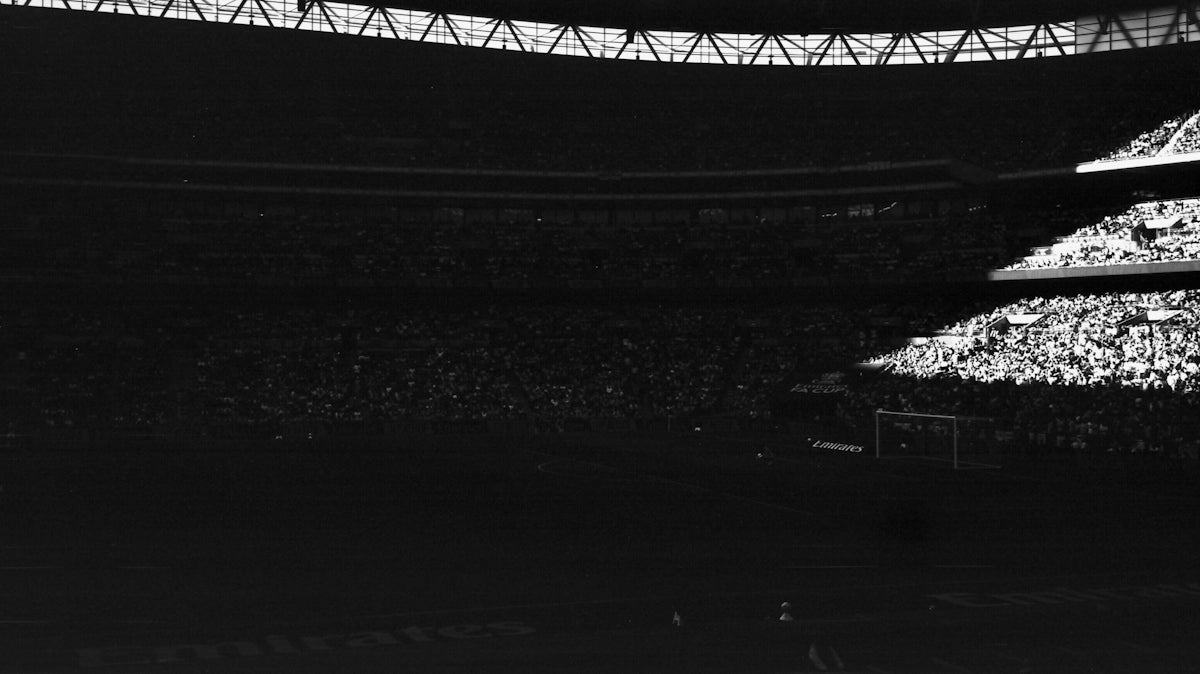 Crowded stadium with bright lights at night