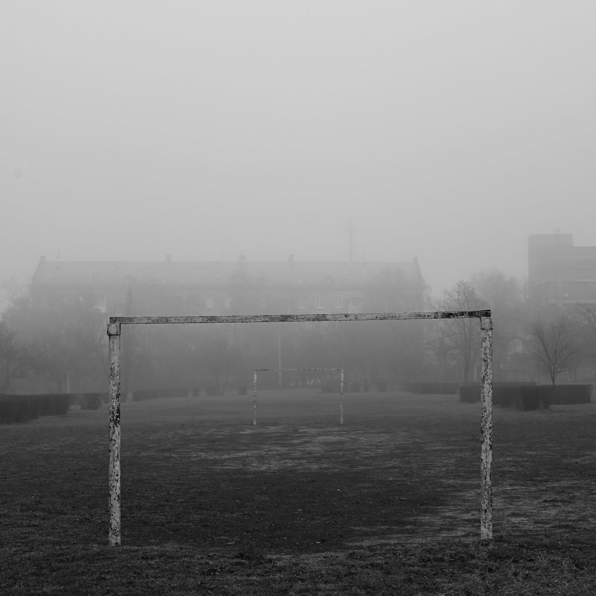 a black and white photo of a soccer goal