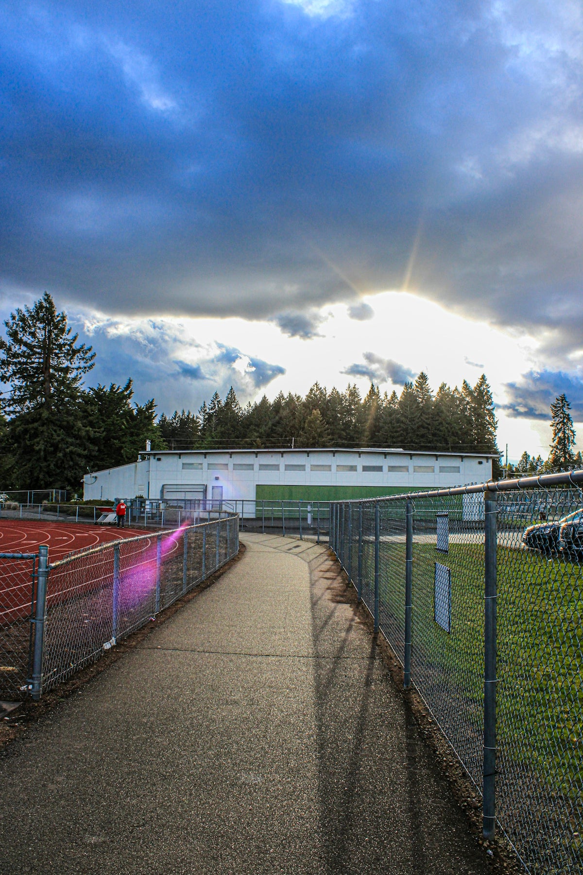 a tennis court with a tennis court in the background
