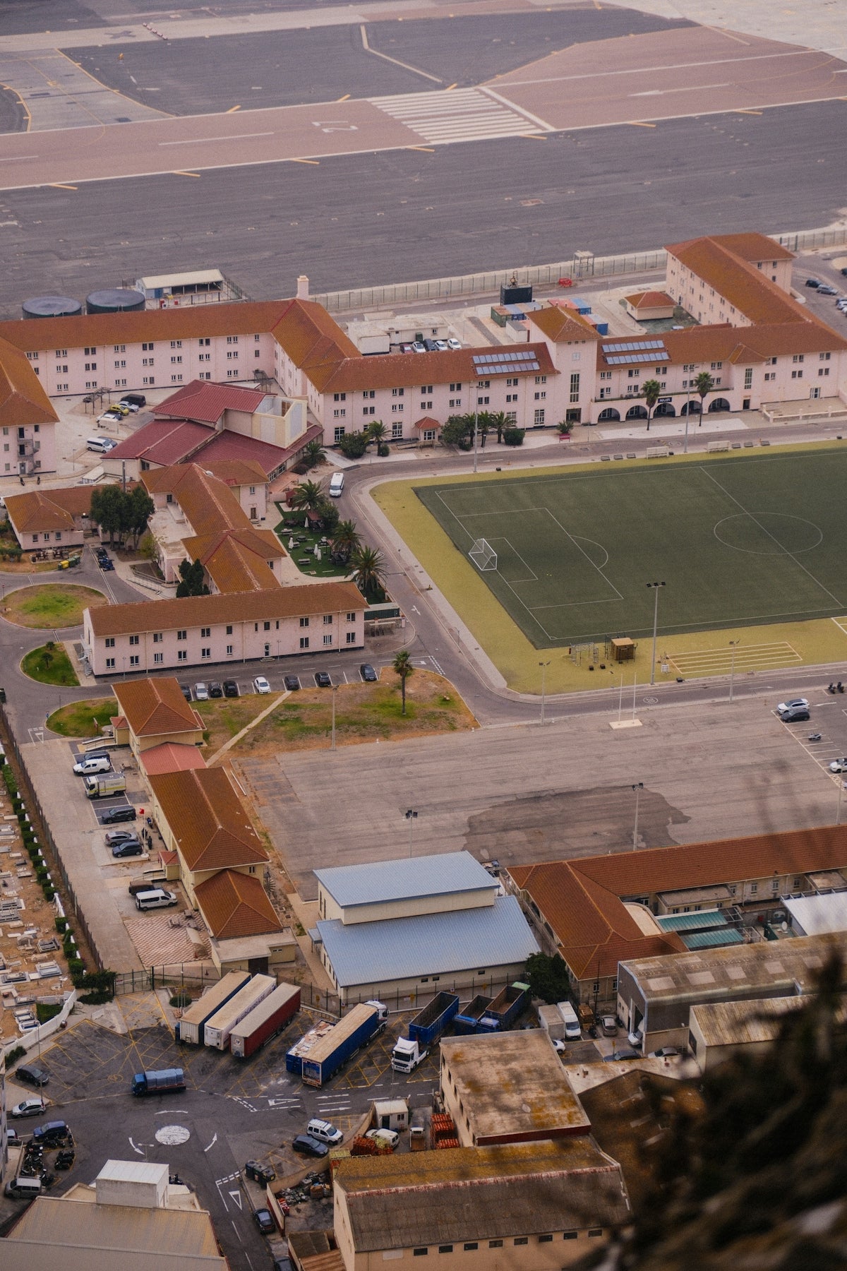Aerial view of military barracks and sports field.