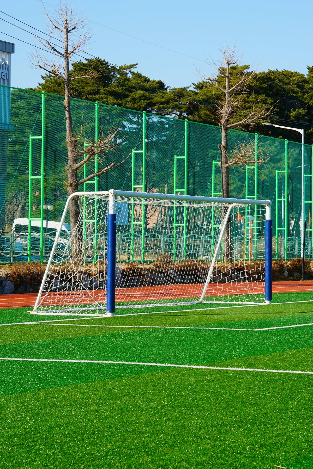 A white soccer goal on a green field