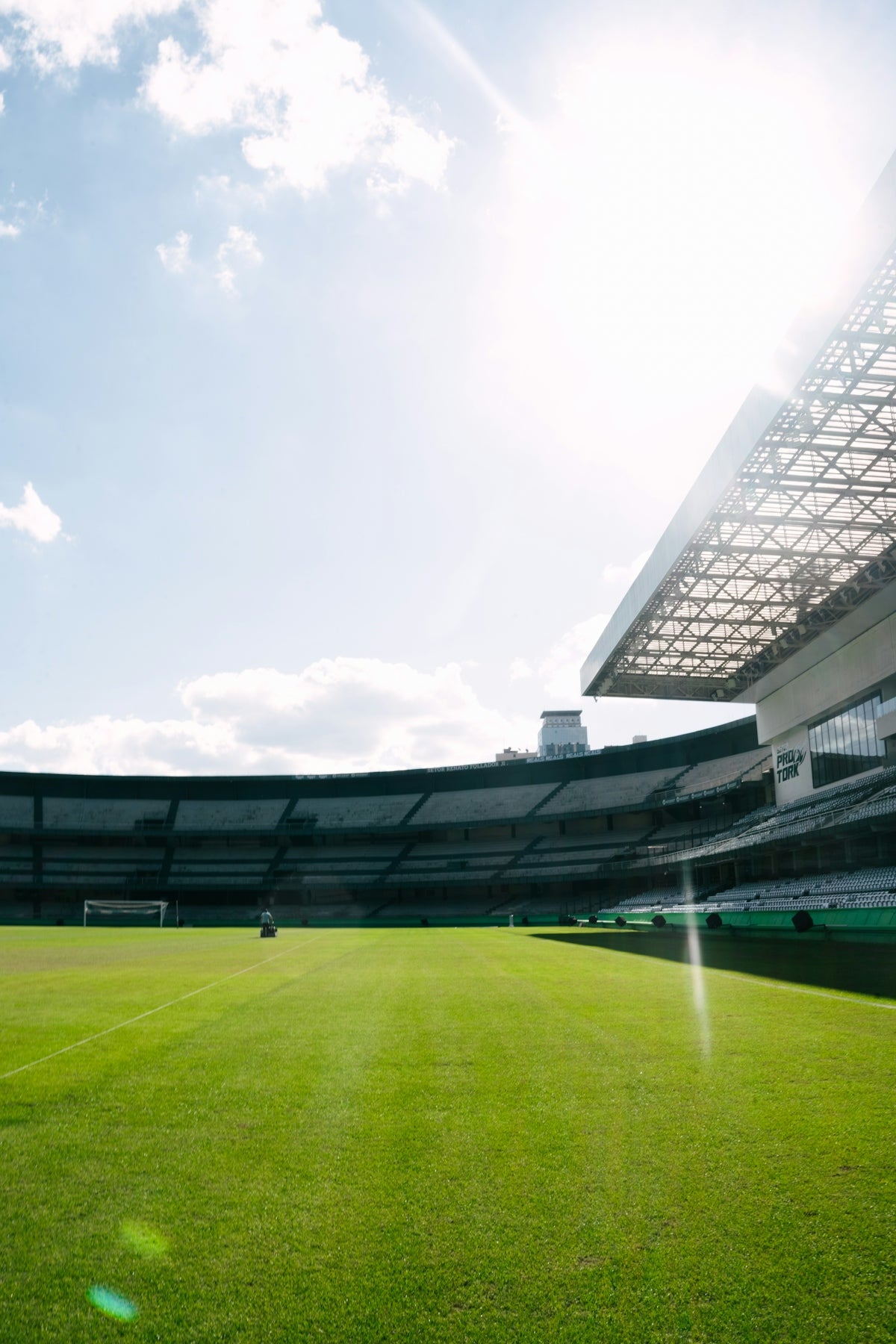 A sunny day at a large empty football stadium