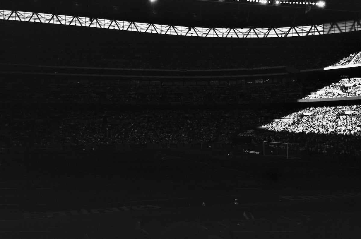 Crowded stadium with bright lights at night